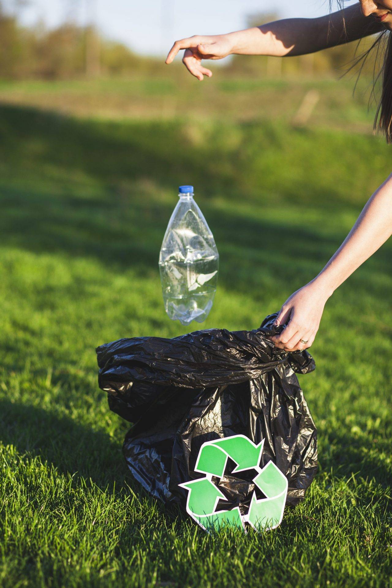recycle-concept-with-woman-collecting-trash (1)